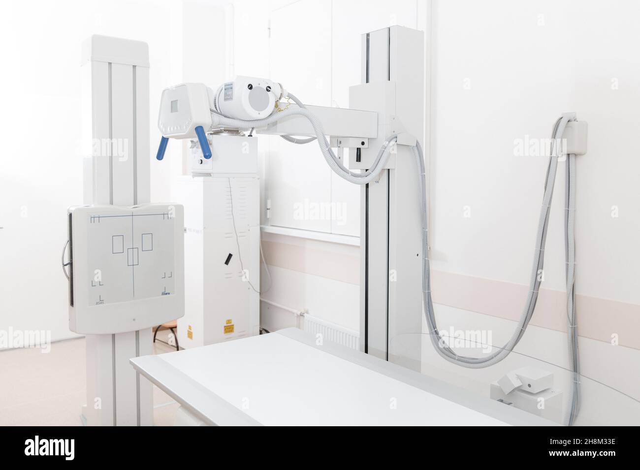 Xray department in modern hospital. Radiology room with scan machine