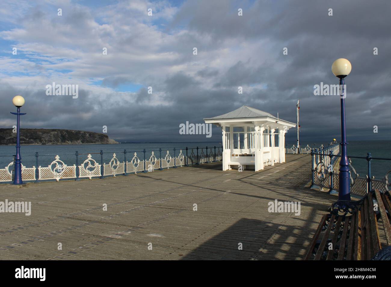 Traditional Victorian Shelter and seating at the end of Swanage Pier, Dorset, England Stock Photo