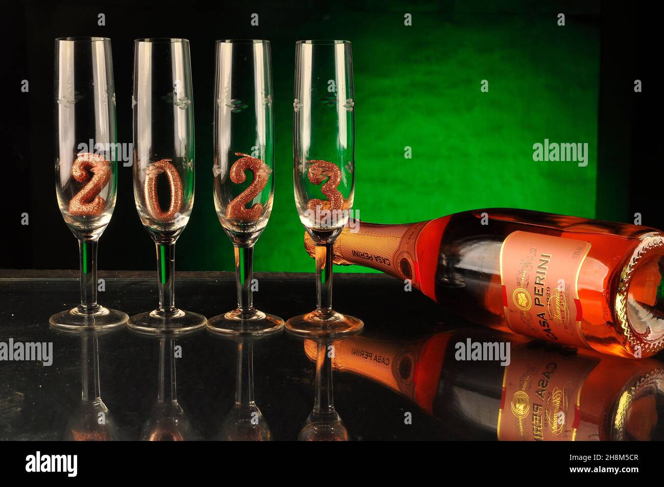 Bottle of Champagne with glasses showing the New Year 2022 coming soon Stock Photo