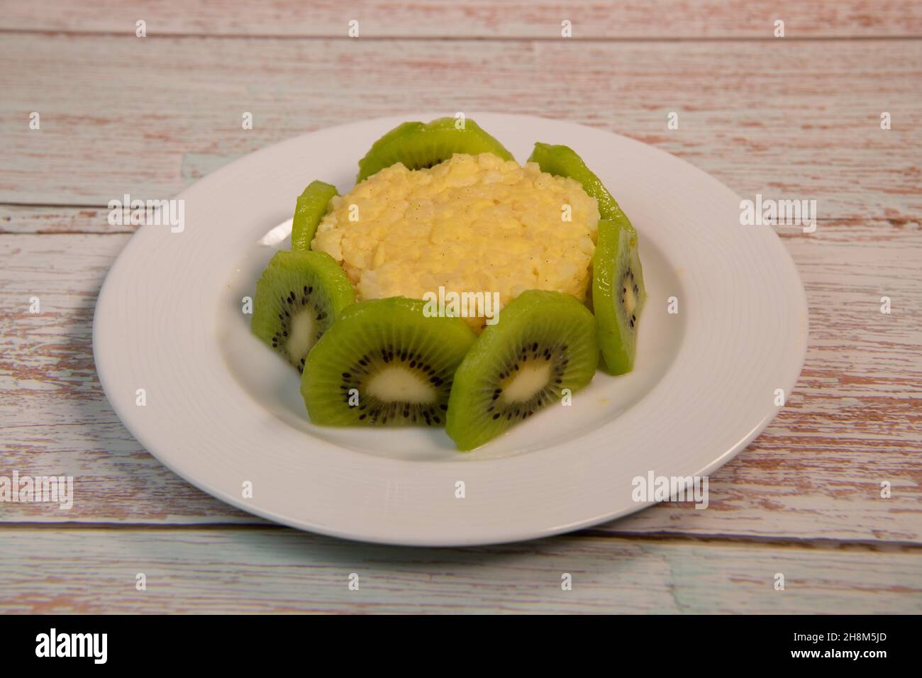 Baby eating rice pudding hires stock photography and images Alamy