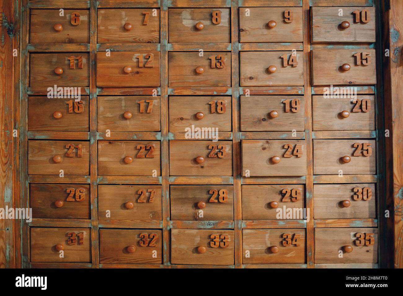 Background texture wallpaper old vintage wooden cabinet with lockers drawers file boxes. Stock Photo