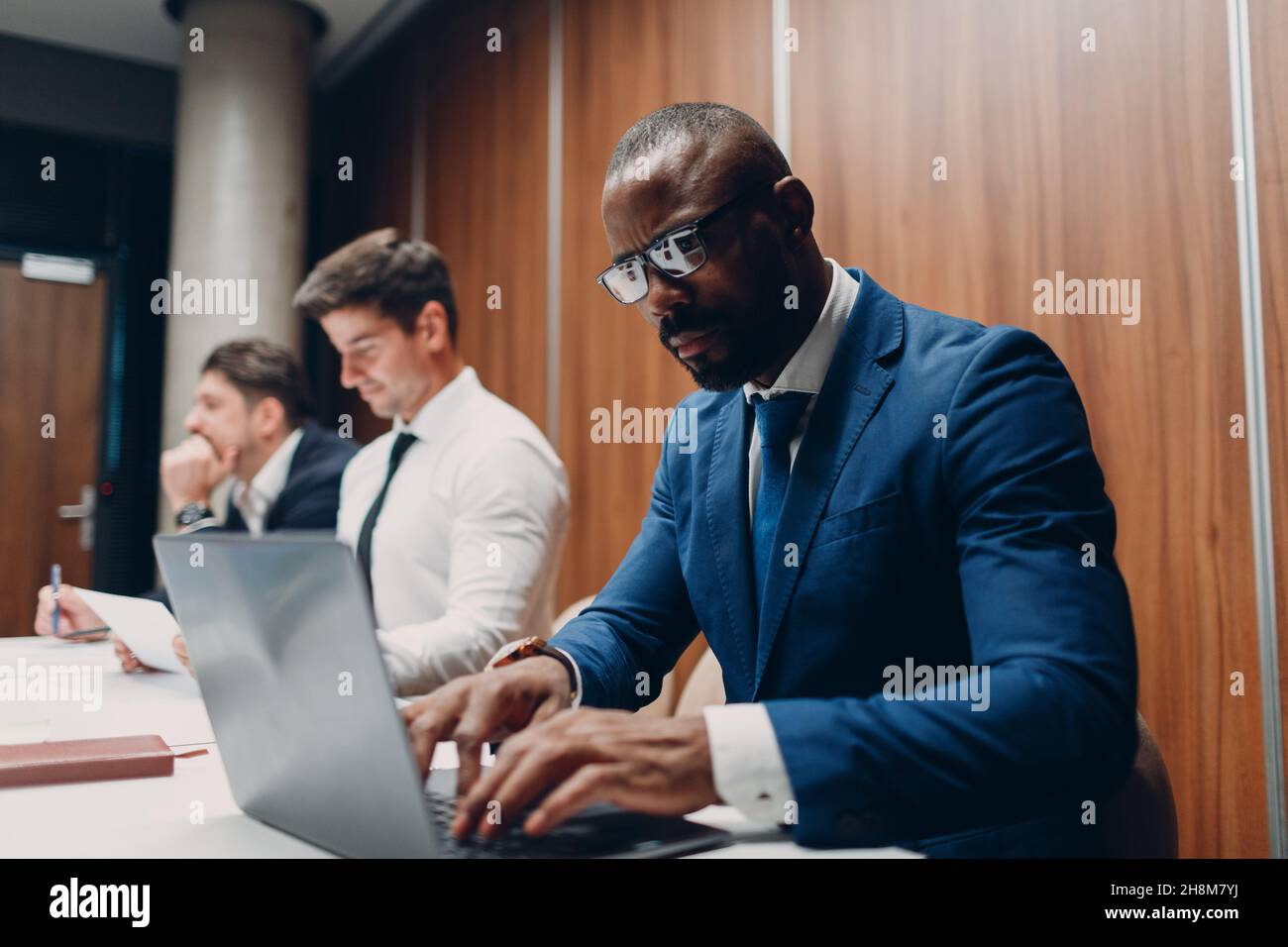 African american black man businessman sitting at table with laptop on ...
