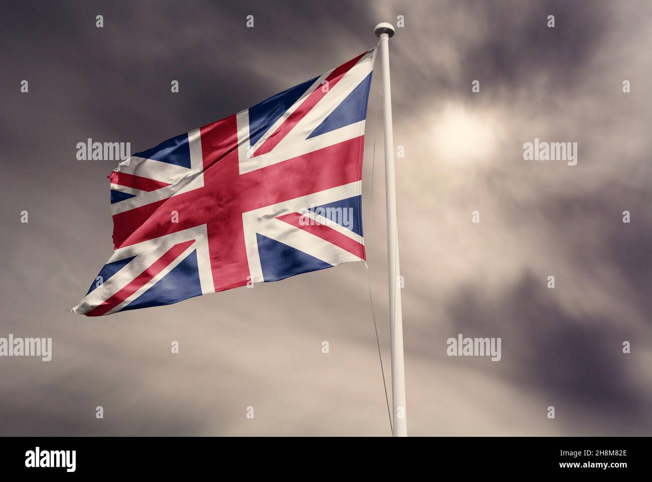 union jack flag on blue sky Stock Photo Alamy
