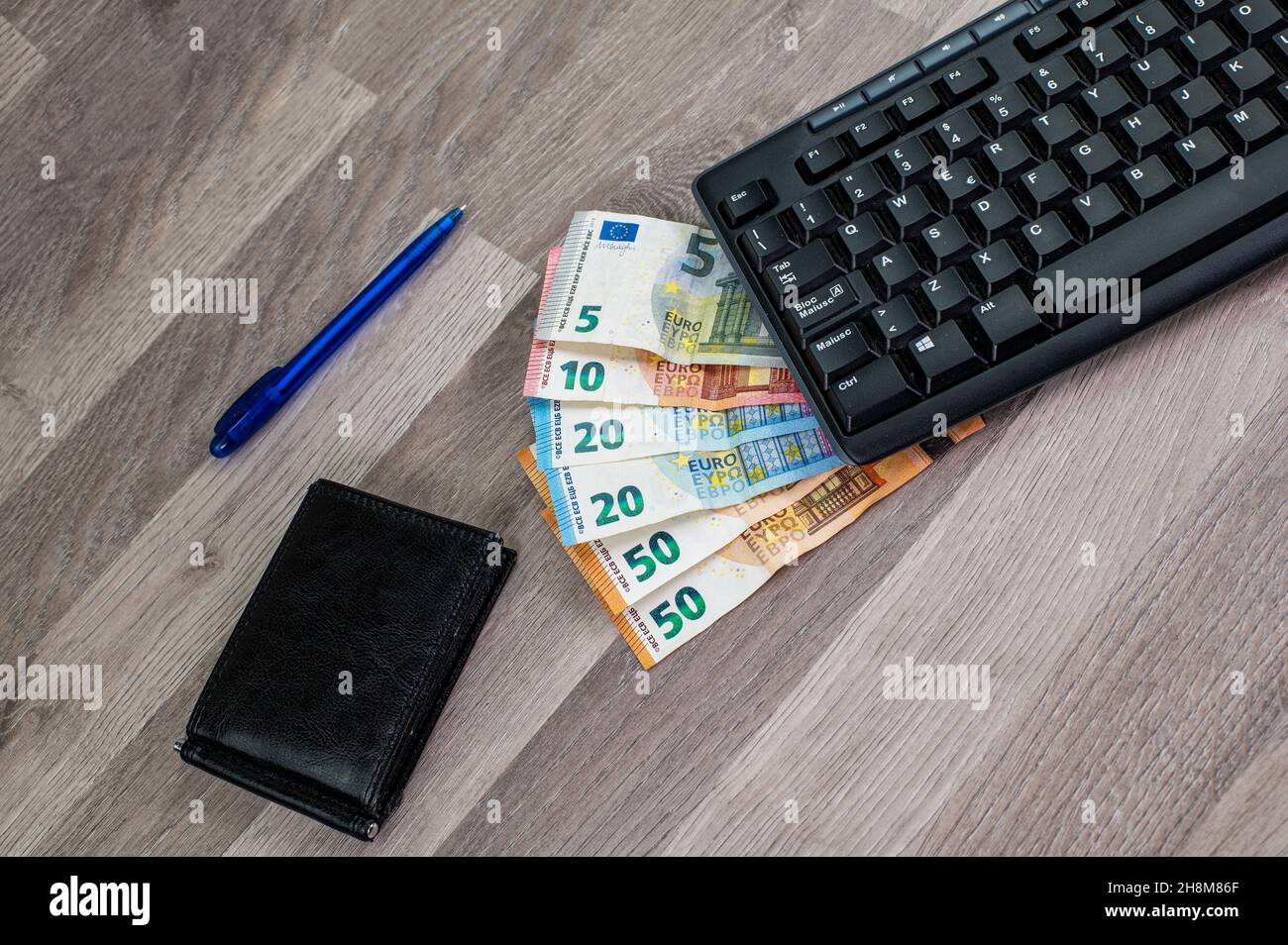 Wallet on five euro hi-res stock photography and images - Alamy