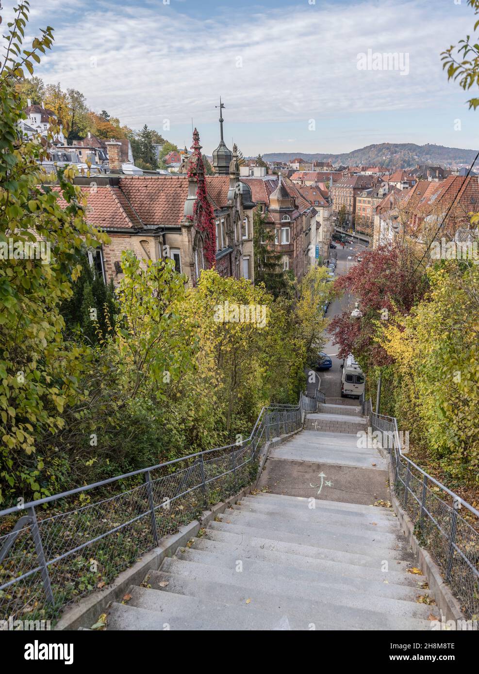 aerial cityscape with steep stairway among autumn vegetation, shot in ...