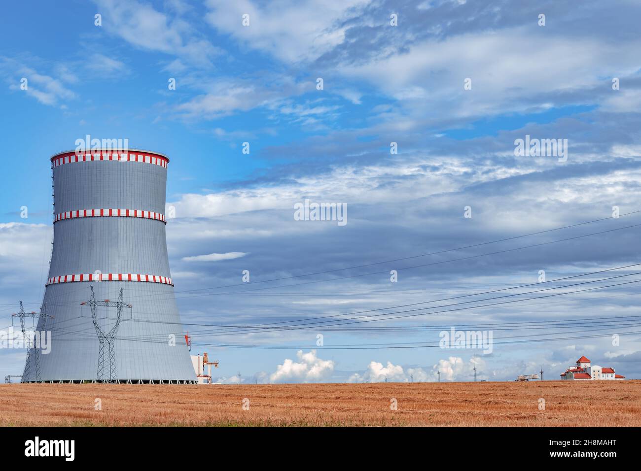 Scenic view of nuclear power plant, cooling towers and high voltage line in Ostrovets, Belarus Stock Photo