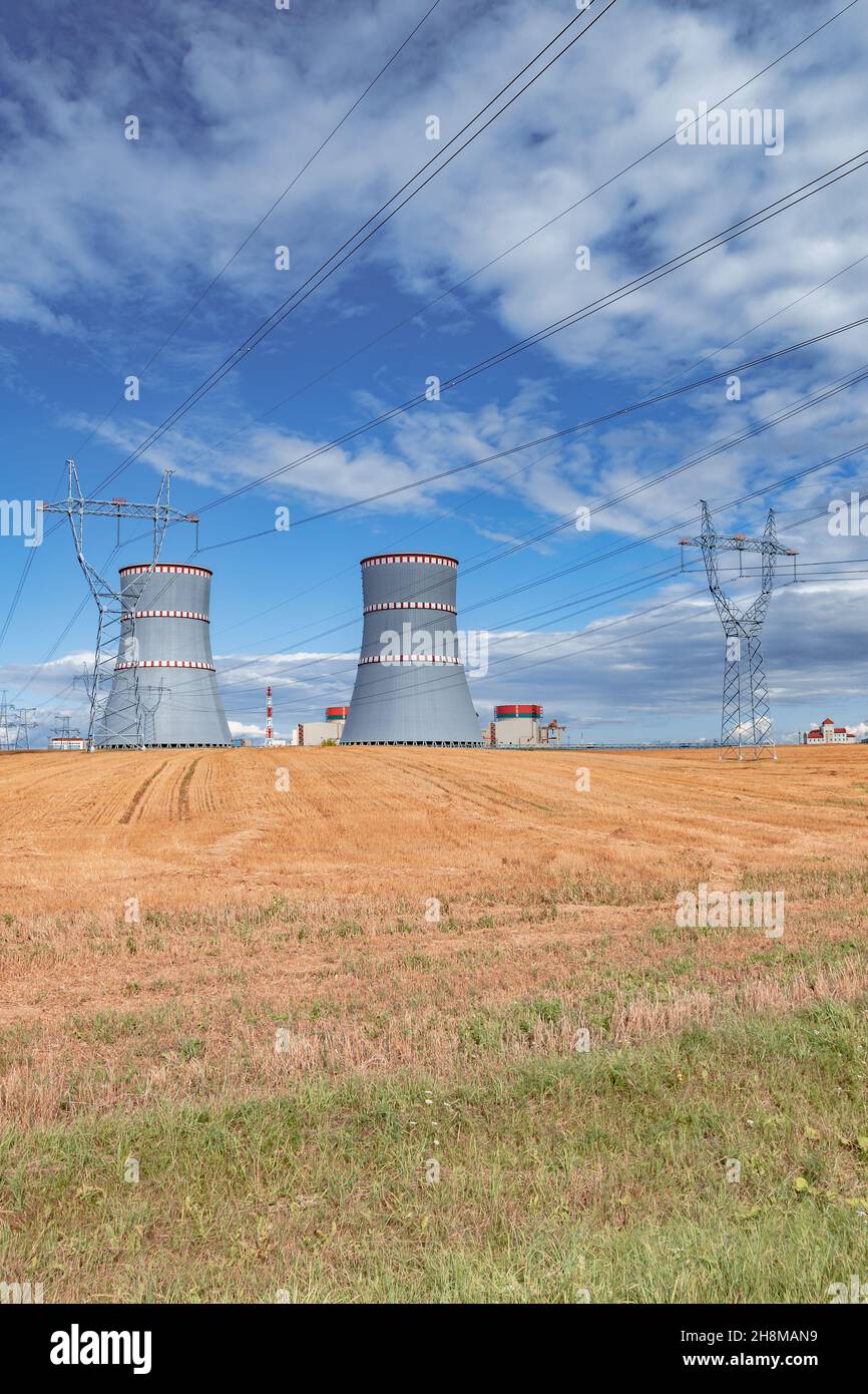 Scenic view of nuclear power plant, cooling towers and high voltage line in Ostrovets, Belarus Stock Photo