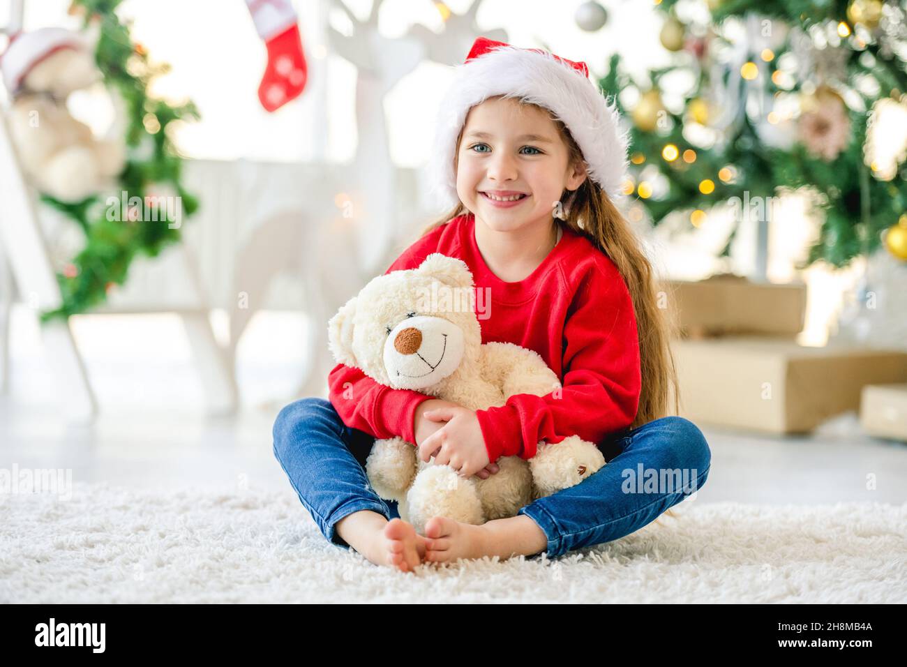 Positive girl in santa hi-res stock photography and images - Alamy