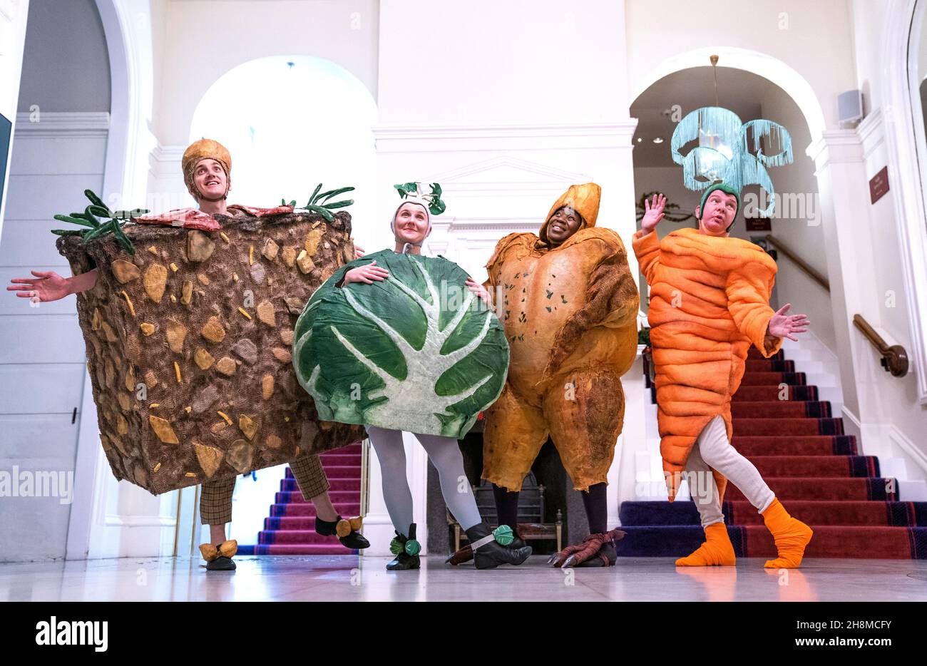 Cast members (from left) Ronan McMahon, Sita Pieraccini, Florence Odumosu and Richard Conlon get into character ahead of their show 'Christmas Dinner' at the Lyceum Theatre, Edinburgh, which will run from 6 December 2021 - 2 January 2022. Picture date: Tuesday November 30, 2021. Stock Photo