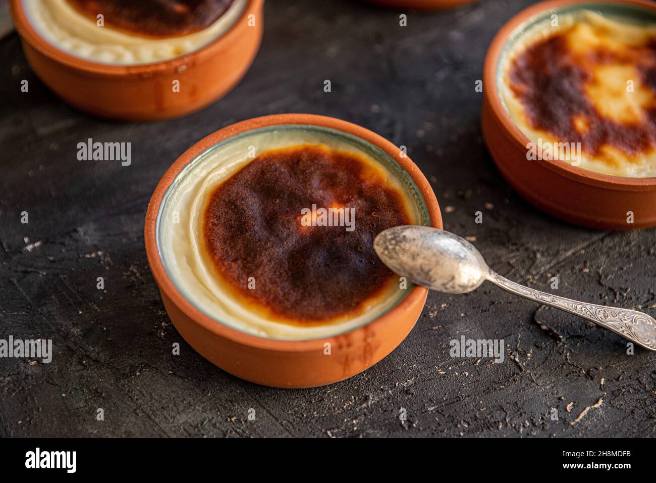 Rice pudding dessert cooked in a clay pot in the oven. Ready to serve ...