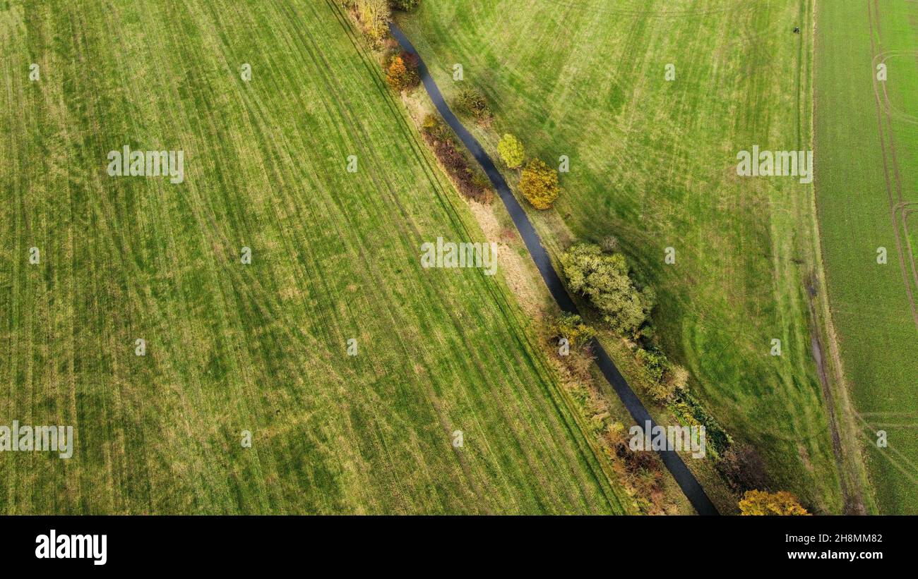 Aerial view of green meadows and fields in a typical small ...