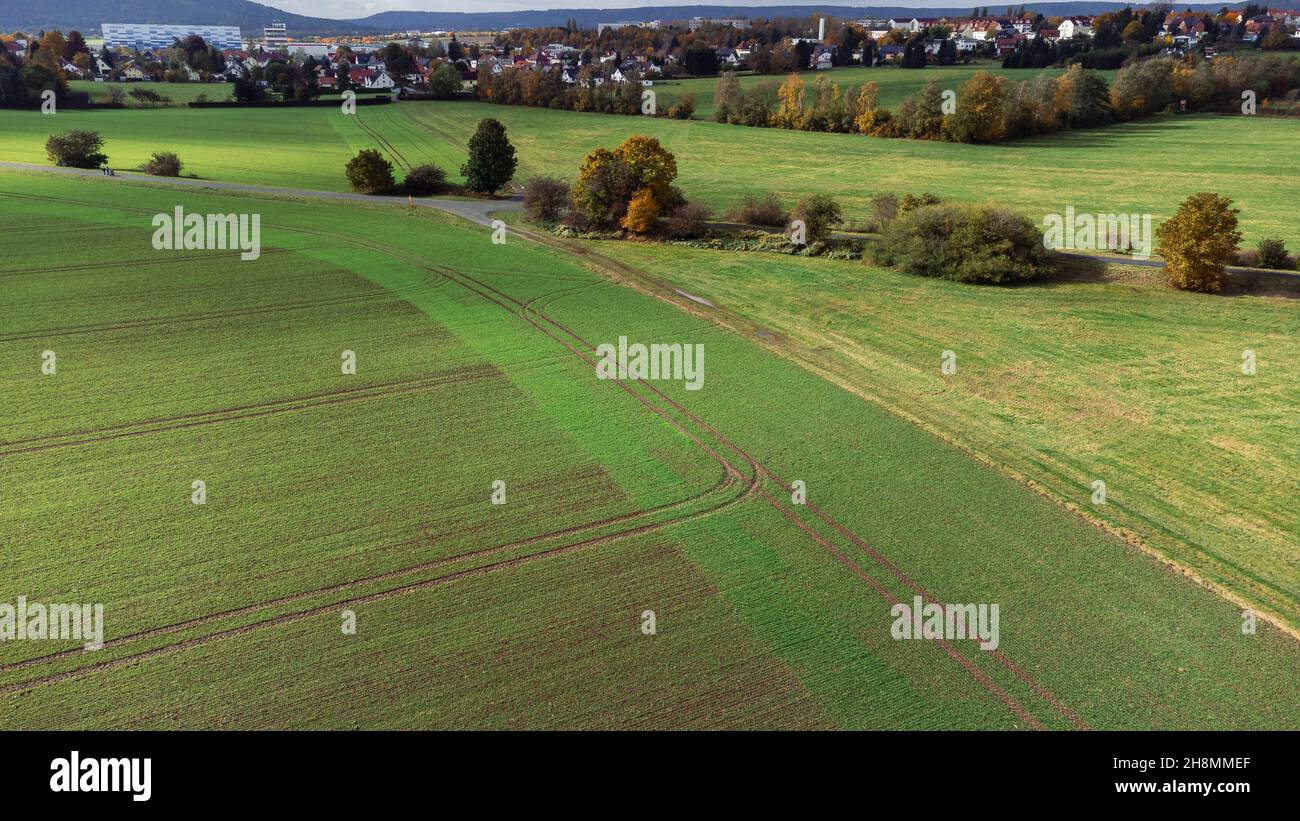 Aerial view of green meadows and fields in a typical small ...