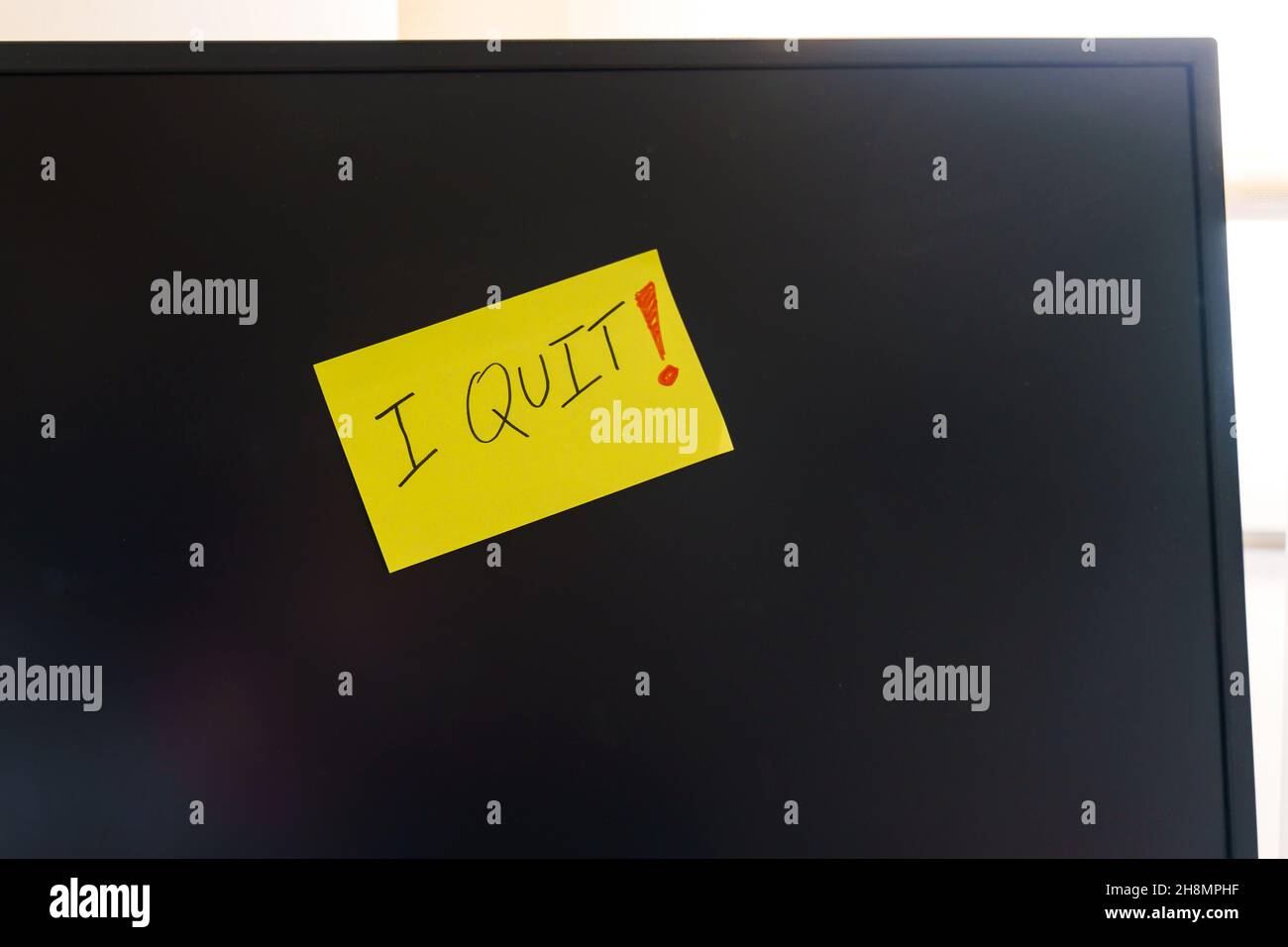 Note on a monitor of a work computer with the text I QUIT. Great