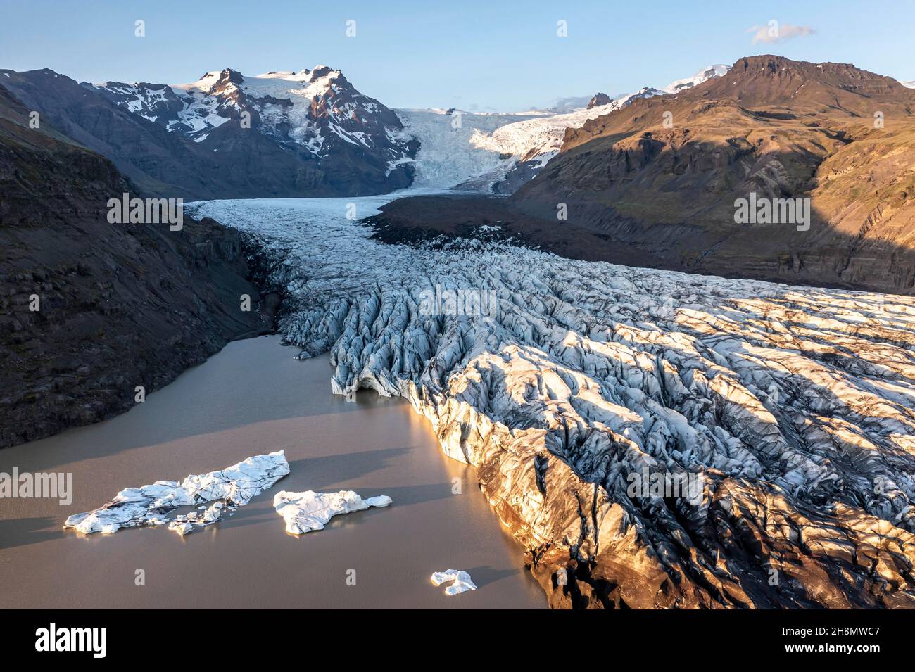 Glacial river in front of Mountains with Hvannadalshnukur, aerial view ...