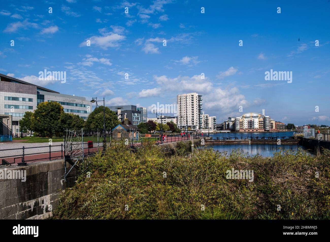 Old waterway leading to Roath Basin at Cardiff Bay surrounded by offices and apartments. Stock Photo