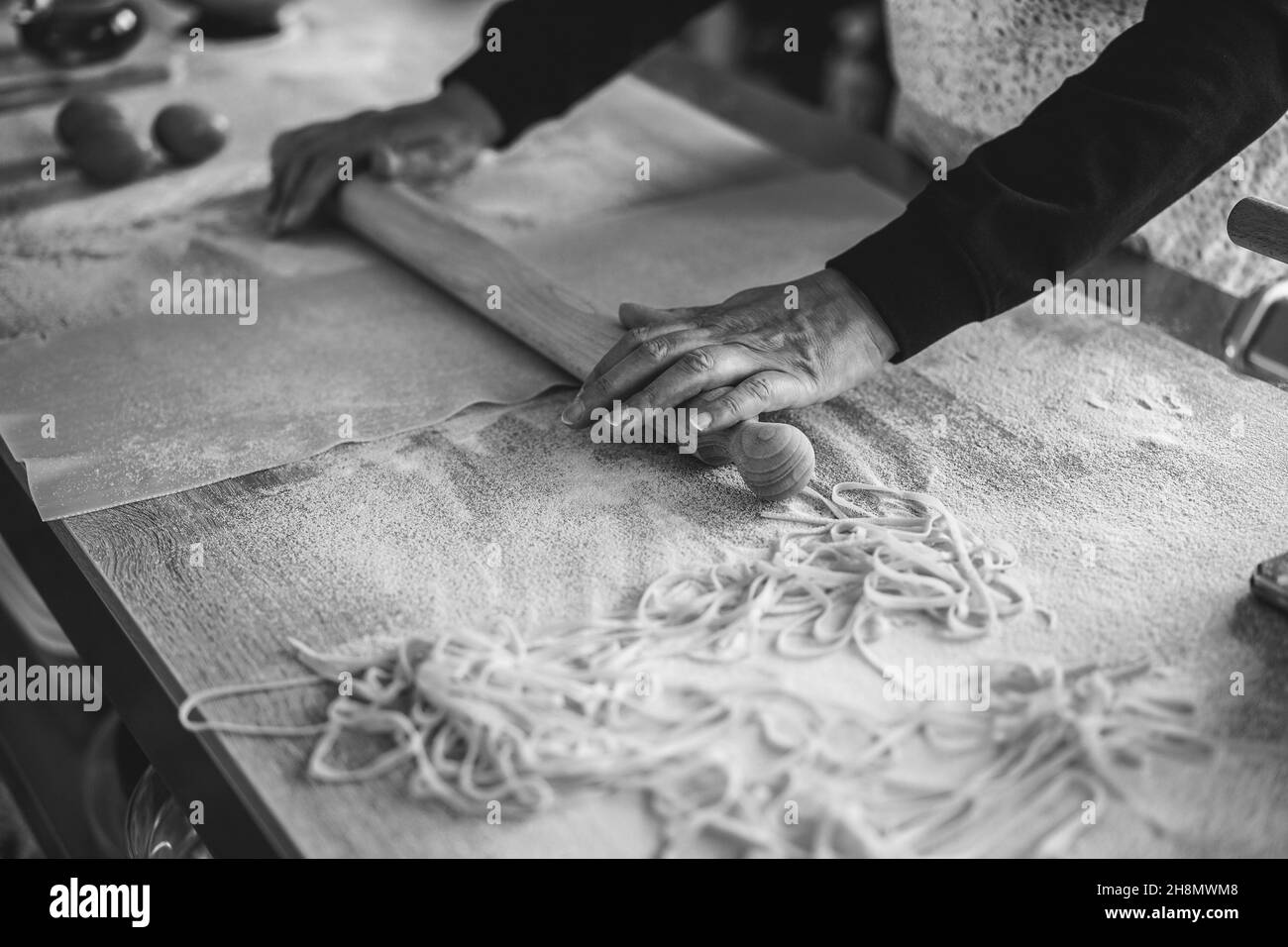 Woman prepare traditional pasta inside italian factory Stock Photo