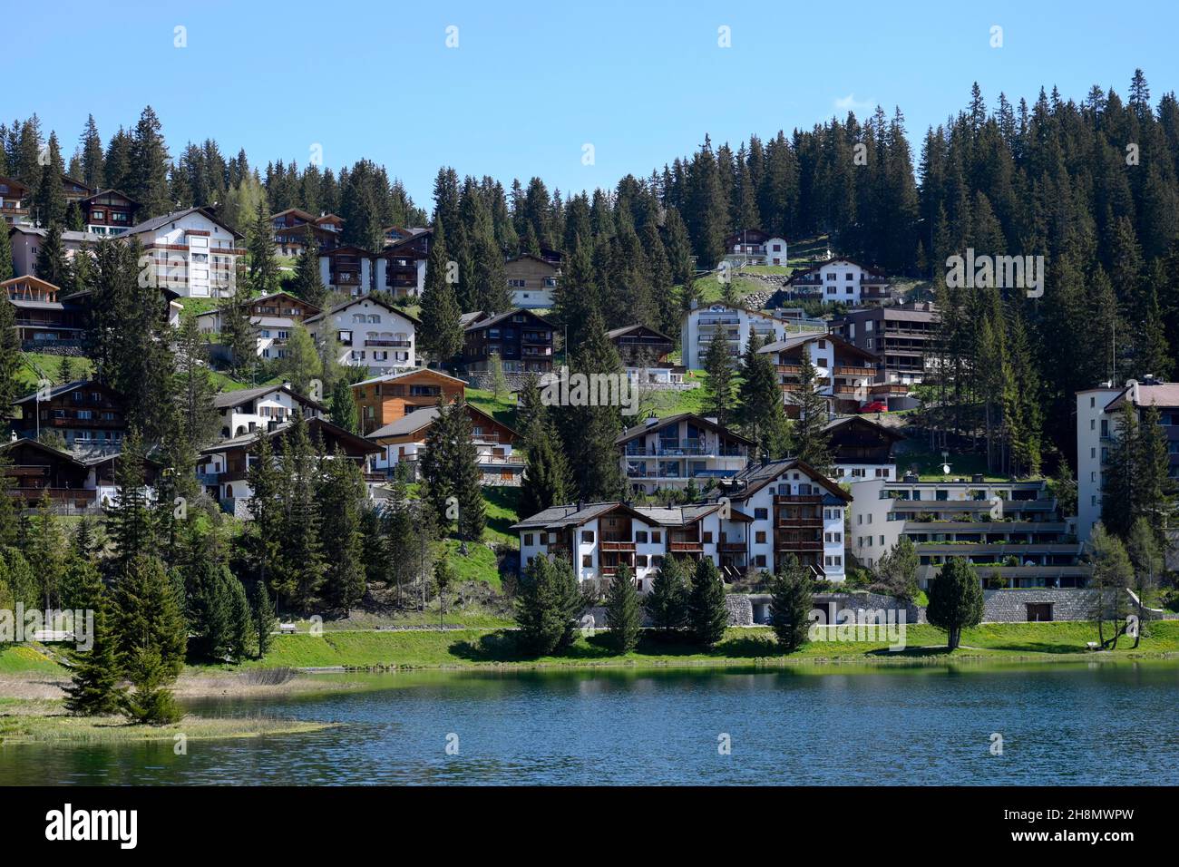 Multi-family houses on a slope with lake access, Arosa, Switzerland Stock Photo