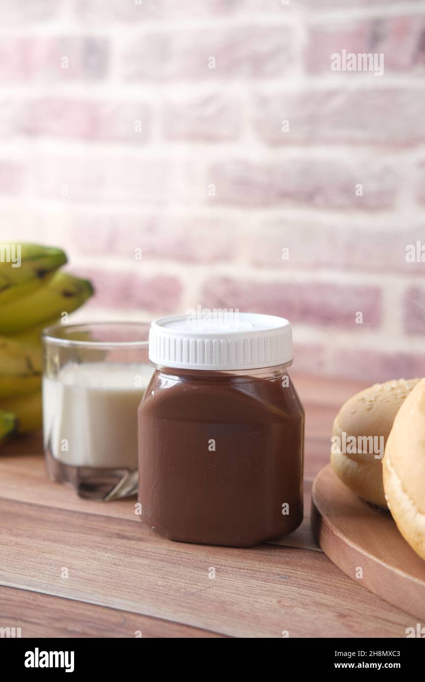 Chocolate Hazelnut cream in a container on table  Stock Photo