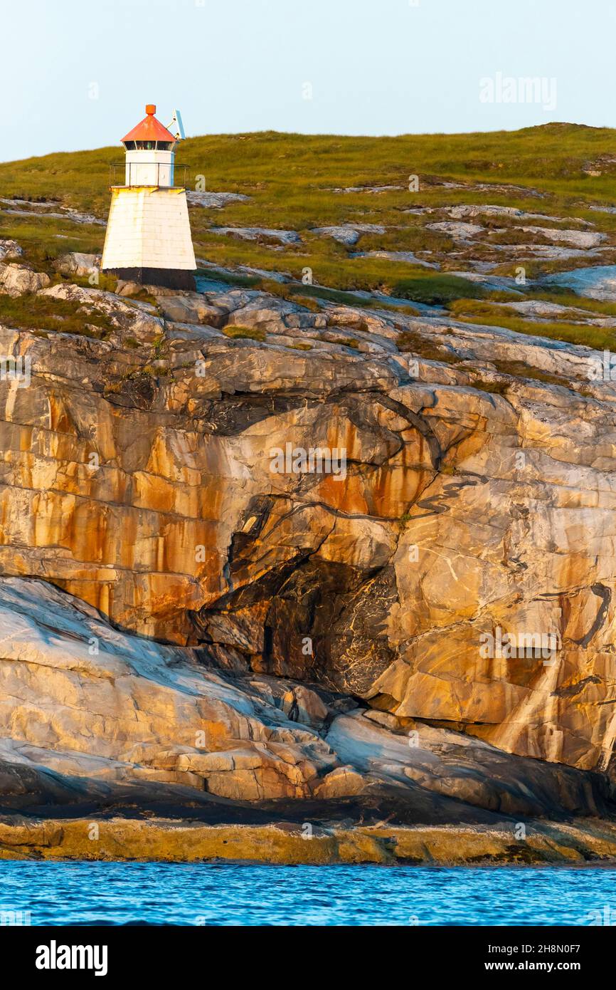 Lighthouse in fjord, coast, Old Atlantic, rocks, rocky coast, Lauvsnes, North Trondelag, Norway Stock Photo