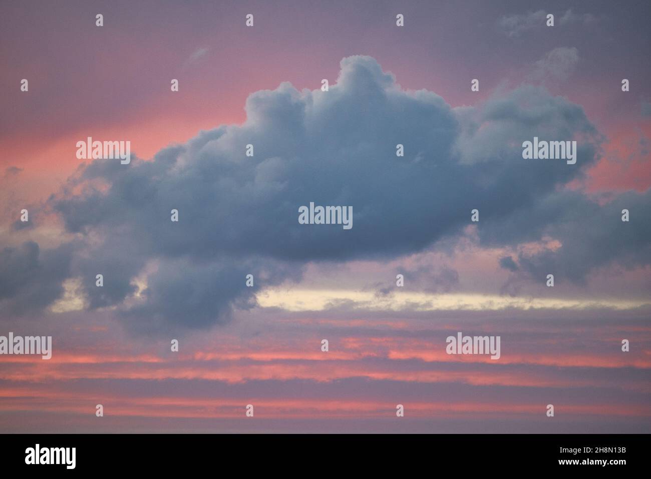 Beautiful scene of clouds in the pink sunset sky Stock Photo - Alamy