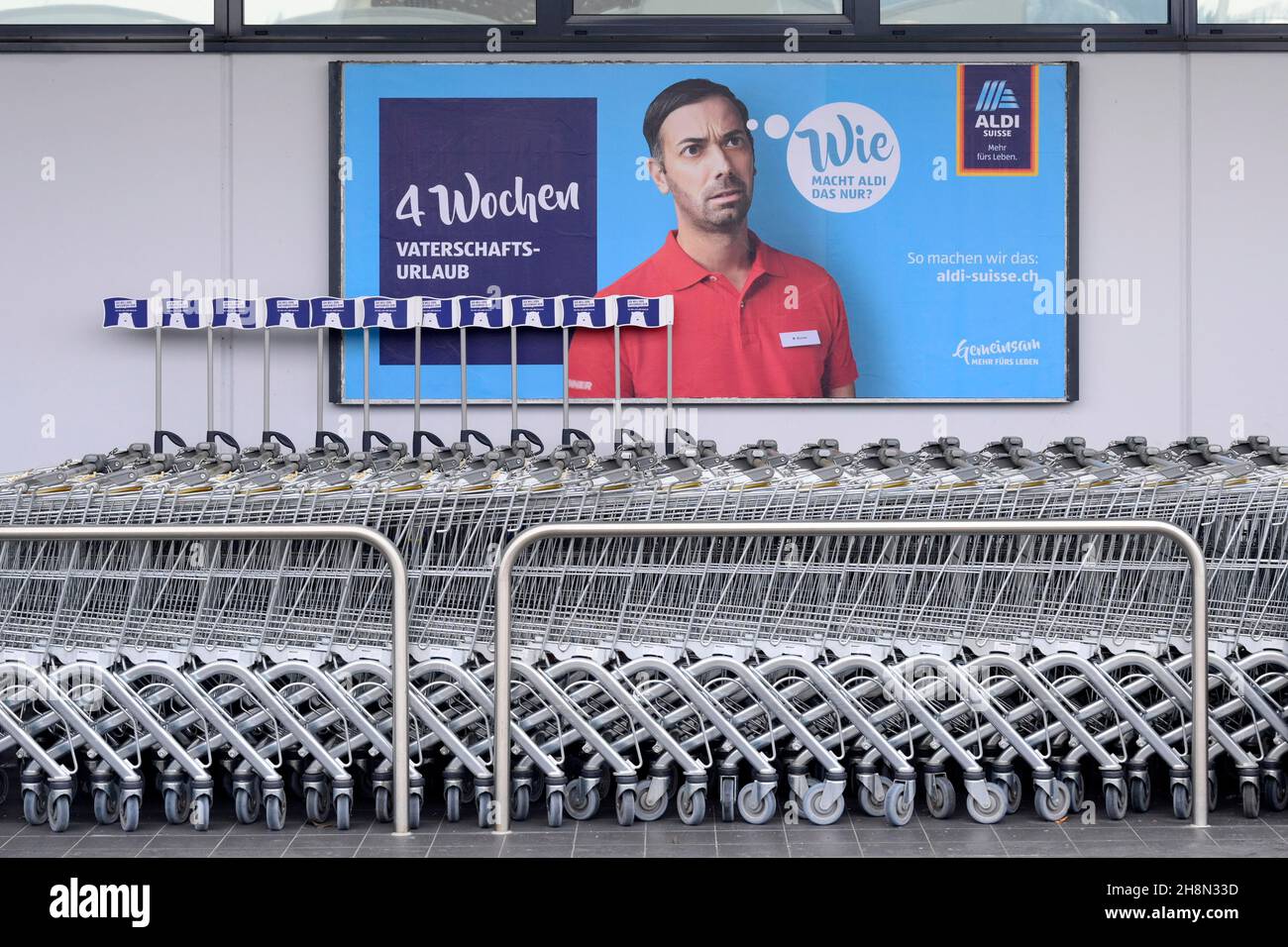 Aldi poster advertising 4 weeks paternity leave, Switzerland Stock