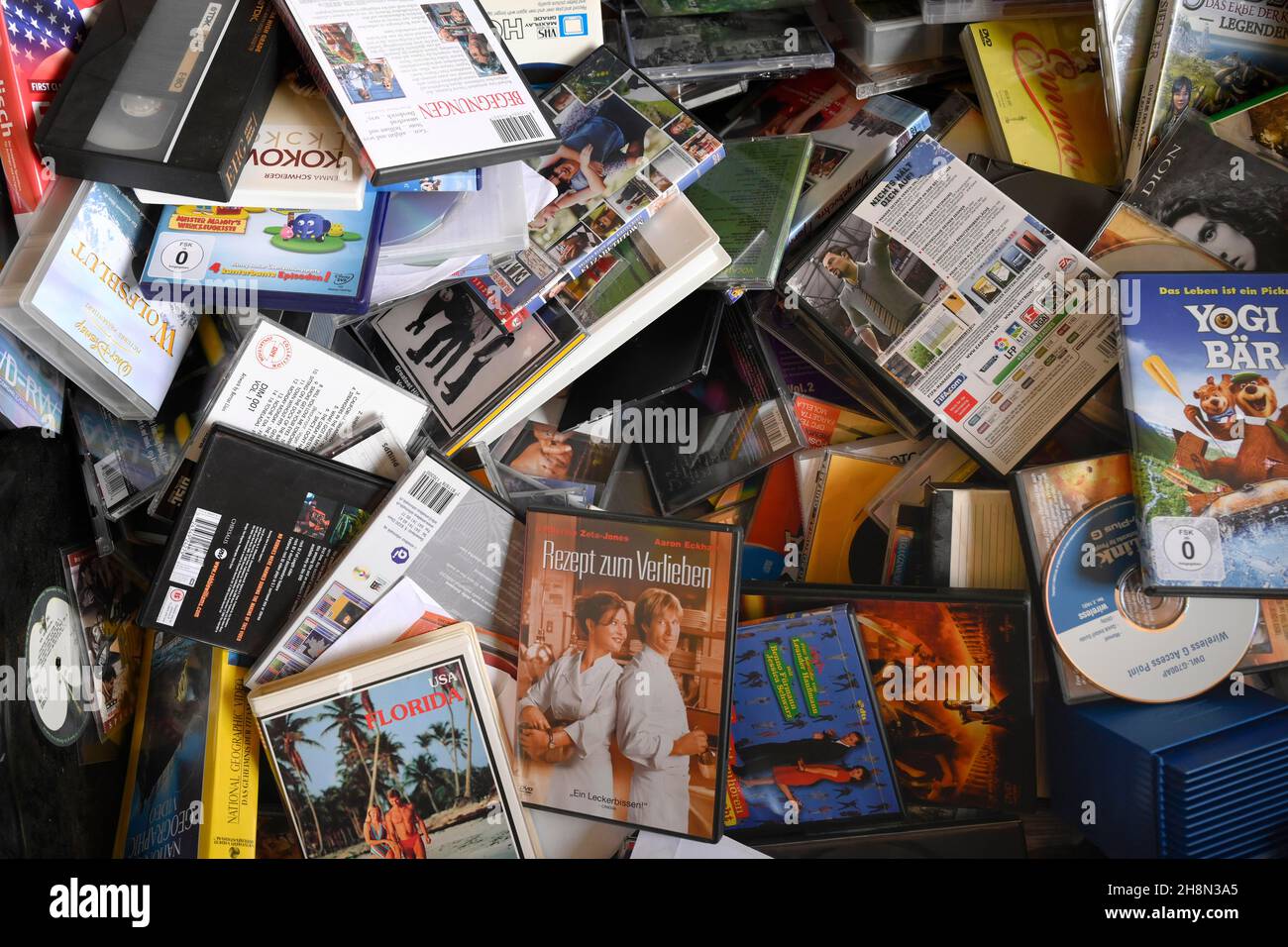 Pile of old DVDs and CDs, disposal point Stock Photo Alamy