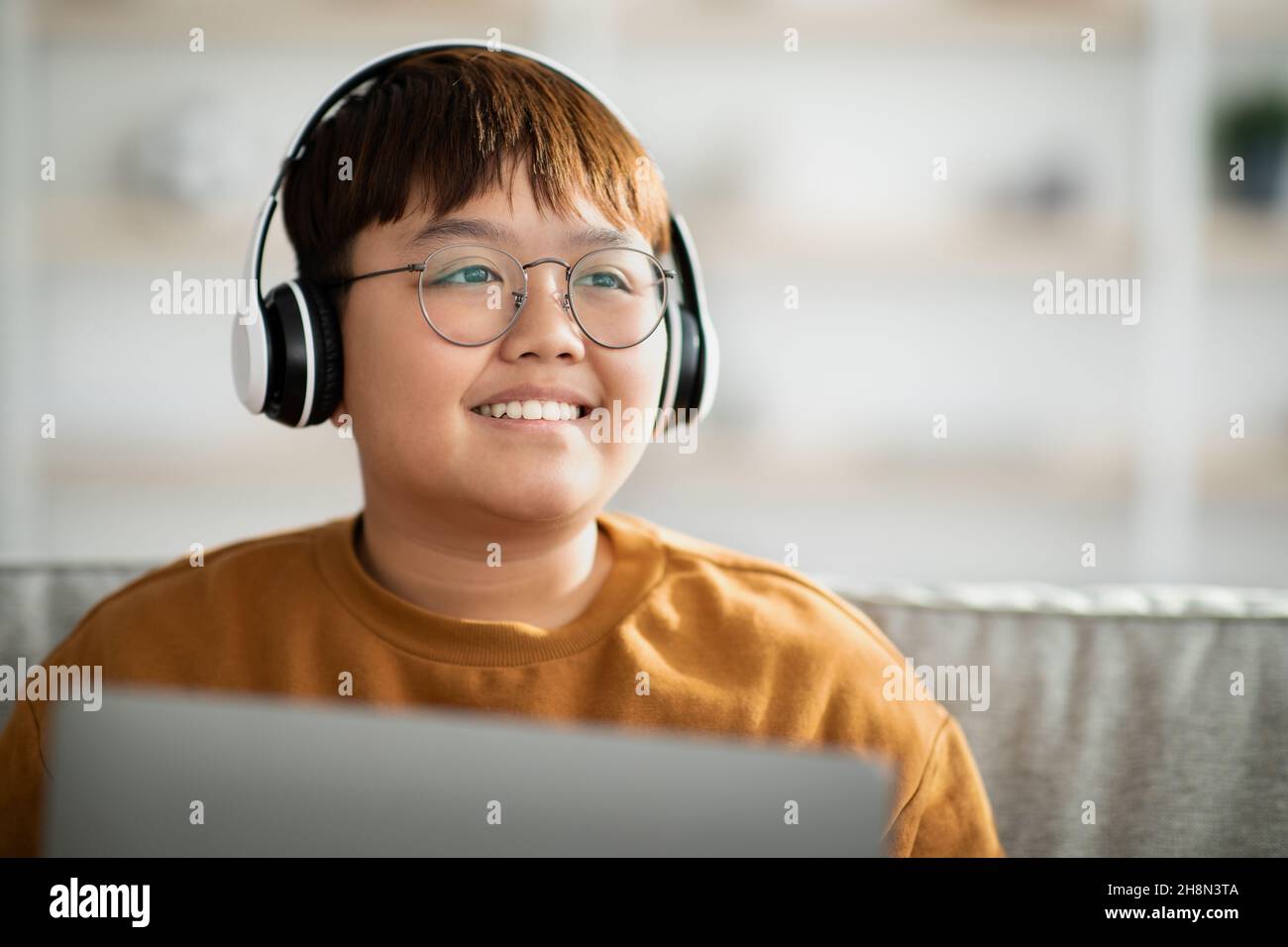 Chubby kid using computer hi-res stock photography and images - Alamy