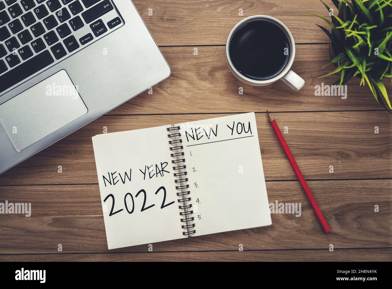 2022 Happy New Year Resolution Goal List and Plans Setting - Business office desk with notebook written about plan listing of new year goals and Stock Photo