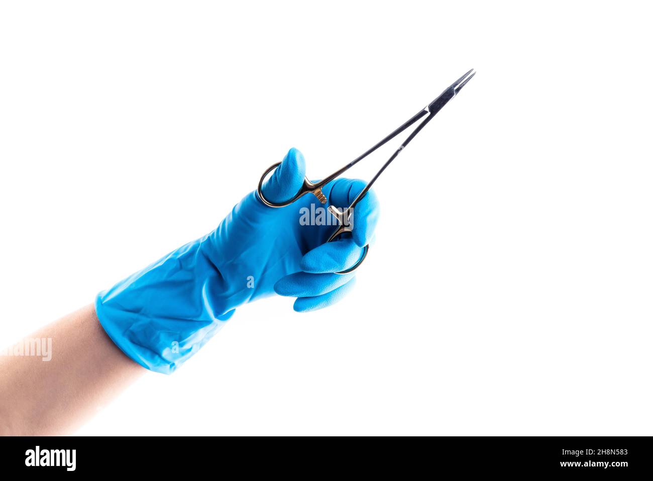 Hand in blue glove holding dental metal instrument isolated Stock Photo