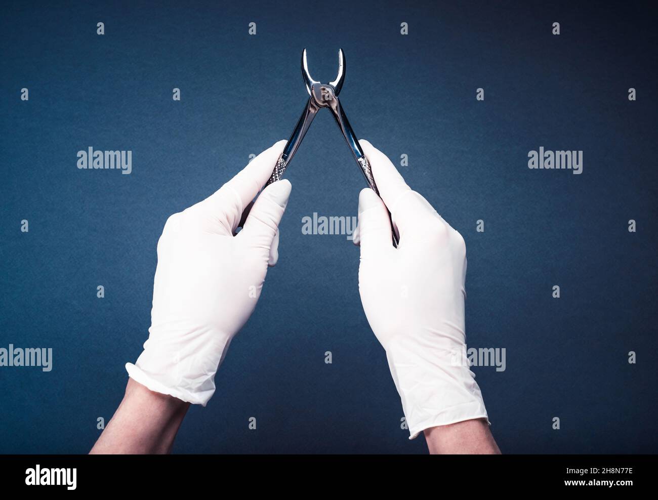 Hand in glove holding medical flatterns Stock Photo