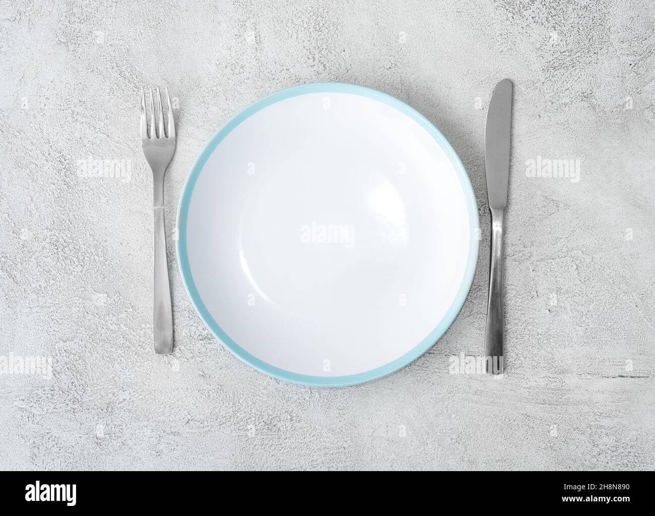 Fork,knife and white plate Stock Photo