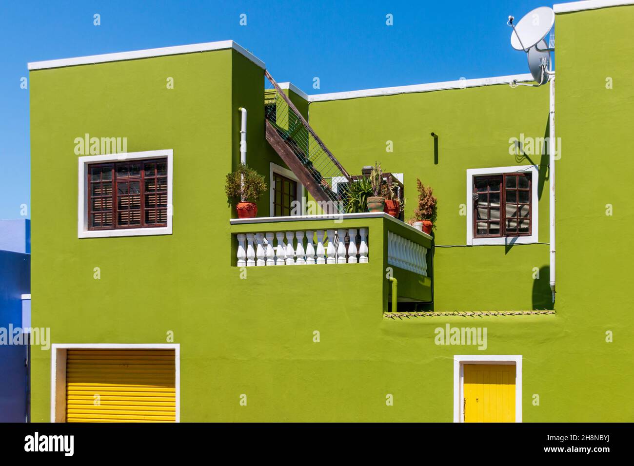 Colorful facades of old houses in olive green, Bo Kaap Malay Quarter, Cape Town, South Africa Stock Photo