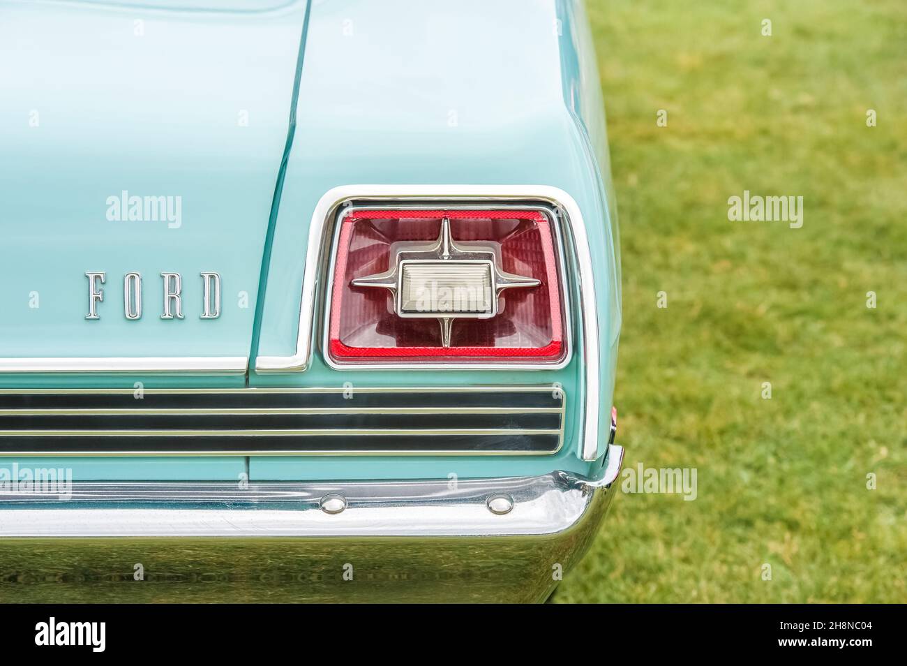 Vintage rear tail-light on a classic 1950s Ford automobile in Yateley ...