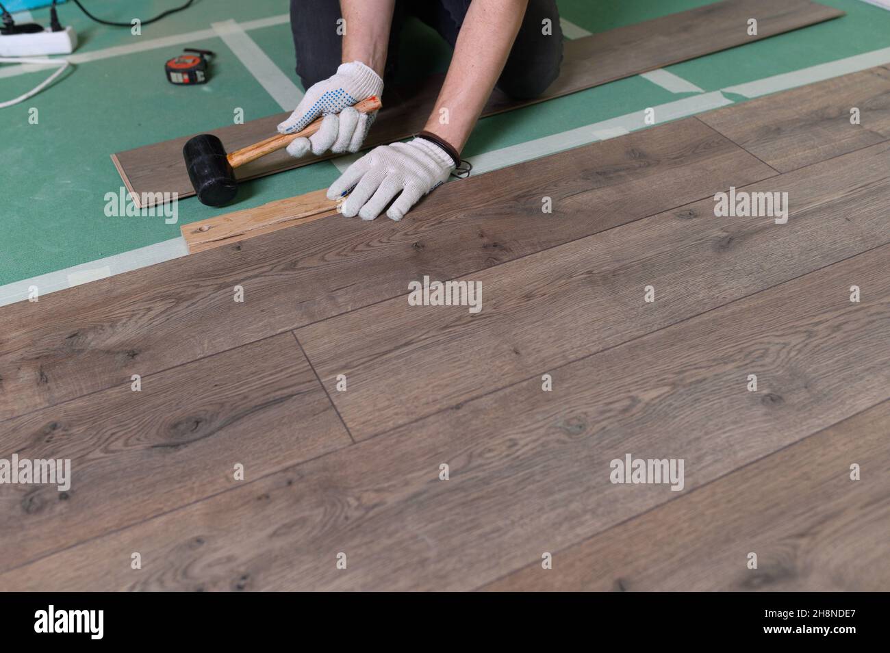 Repair of the apartment, laying laminate flooring. Construction Stock