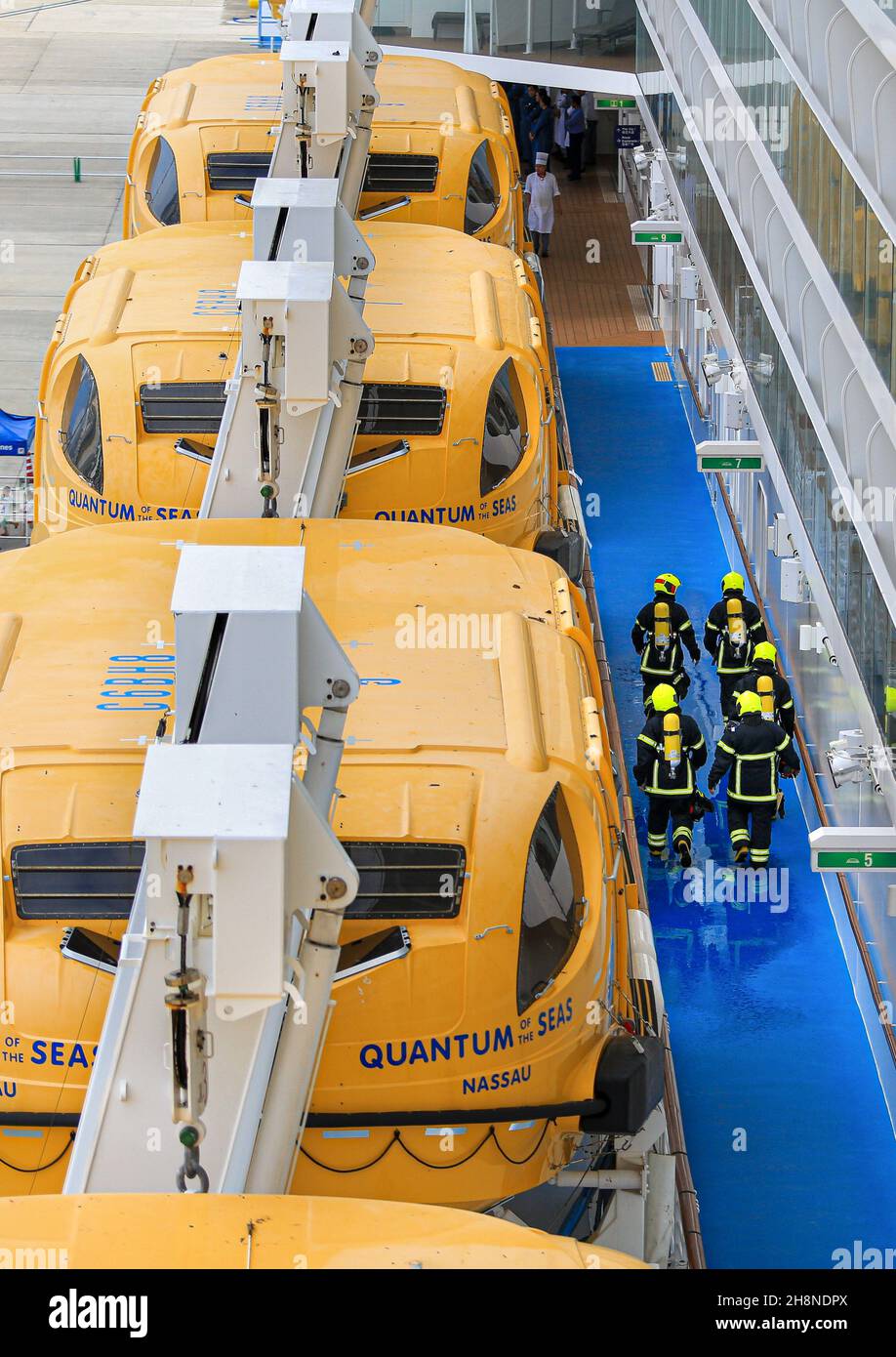 Firefighters in firefighting gear on board Quantum of the Seas cruise ship, Royal Caribbean cruise line, fire fighter, firemen,davits, passenger ships Stock Photo