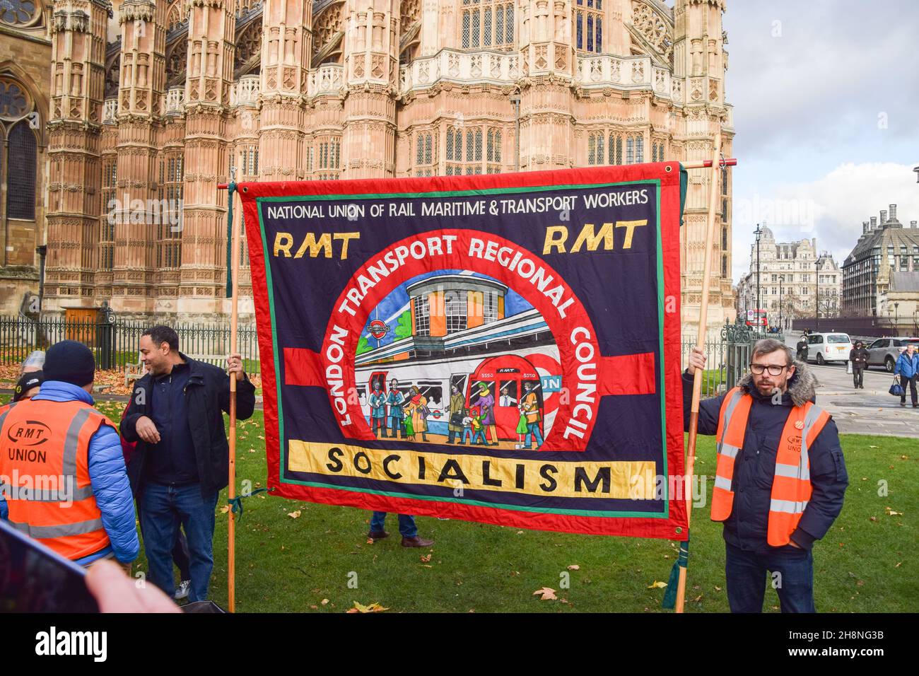 London, UK. 1st December 2021. Transport workers, union members and supporters gathered at Old Palace Yard outside Parliament in protest against threats to salaries and pensions, and threats to services and jobs, which were imposed as part of the bailout of Transport For London. Credit: Vuk Valcic / Alamy Live News Stock Photo