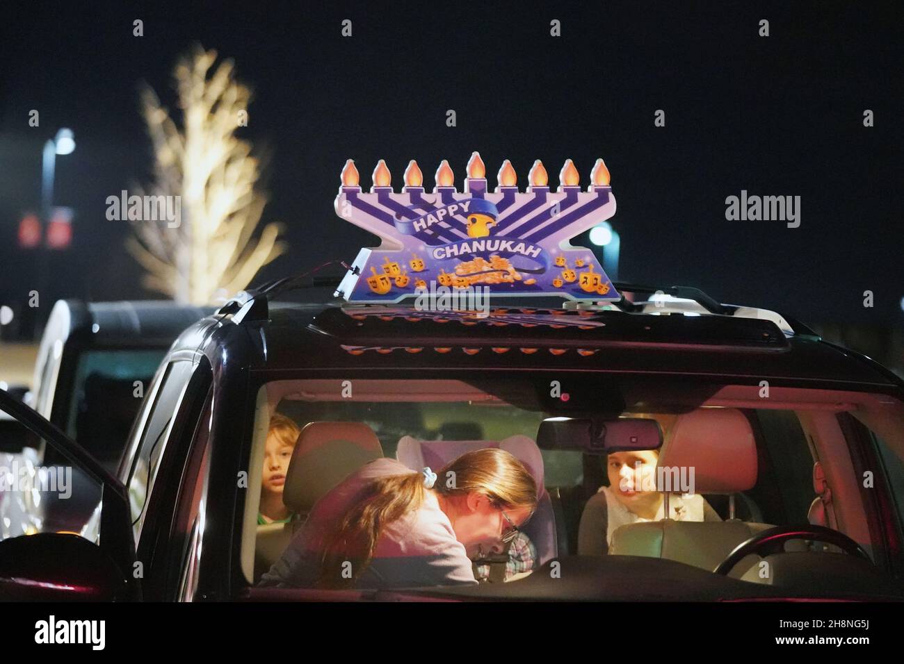 Chesterfield, United States. 30th Nov, 2021. Participants in the annual Chanukah car menorah parade wait in their car before the start in Chesterfield, Missouri on Tuesday, November 30, 2021. Cars travel for several miles in the parade with a lighted menorah attached to their cars, listening to Chanukah music. Photo by Bill Greenblatt/UPI Credit: UPI/Alamy Live News Stock Photo