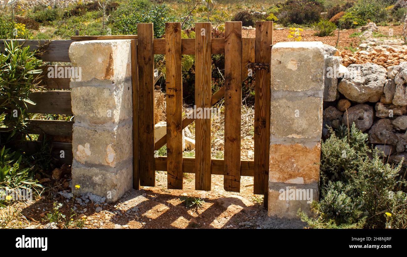 Wooden door with stone walls of the house yard in a village Stock Photo ...