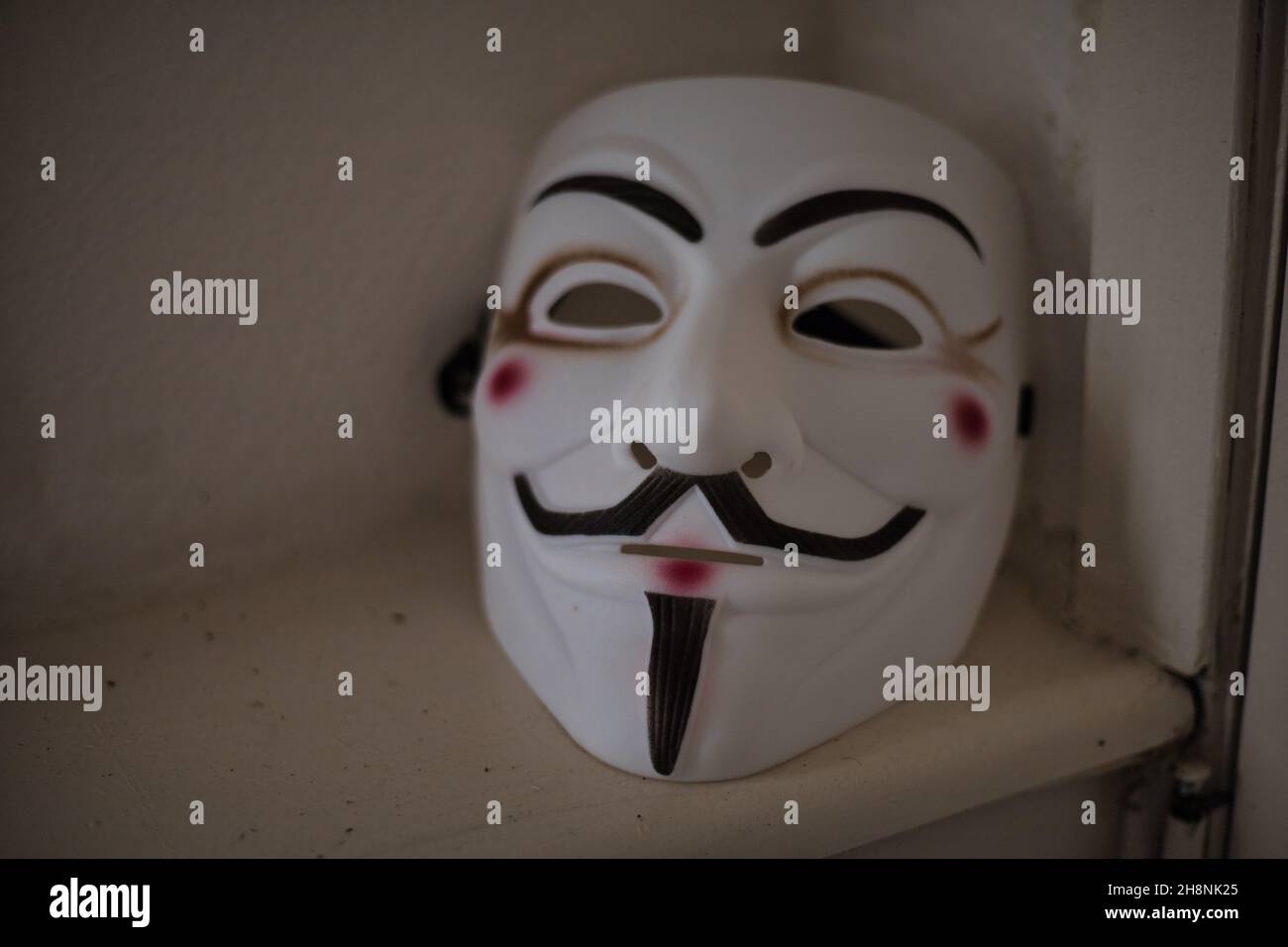 Beautiful shot of Guy Fawkes mask at the shelf Stock Photo Alamy