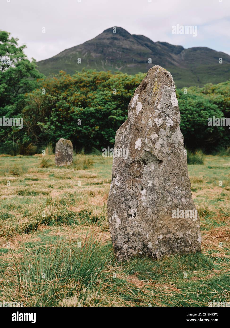 The standing stones of the Lochbuie stone circle and Ben Buie on the Isle of Mull Inner Hebrides Argyll and Bute Scotland UK - Bronze Age Stone Circle Stock Photo