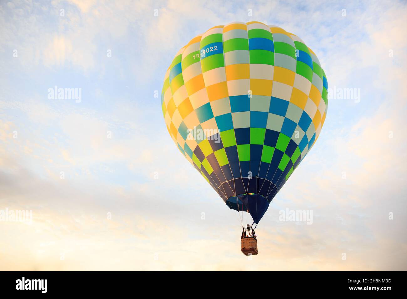 Hot air baloon over the sky at sunset. Stock Photo
