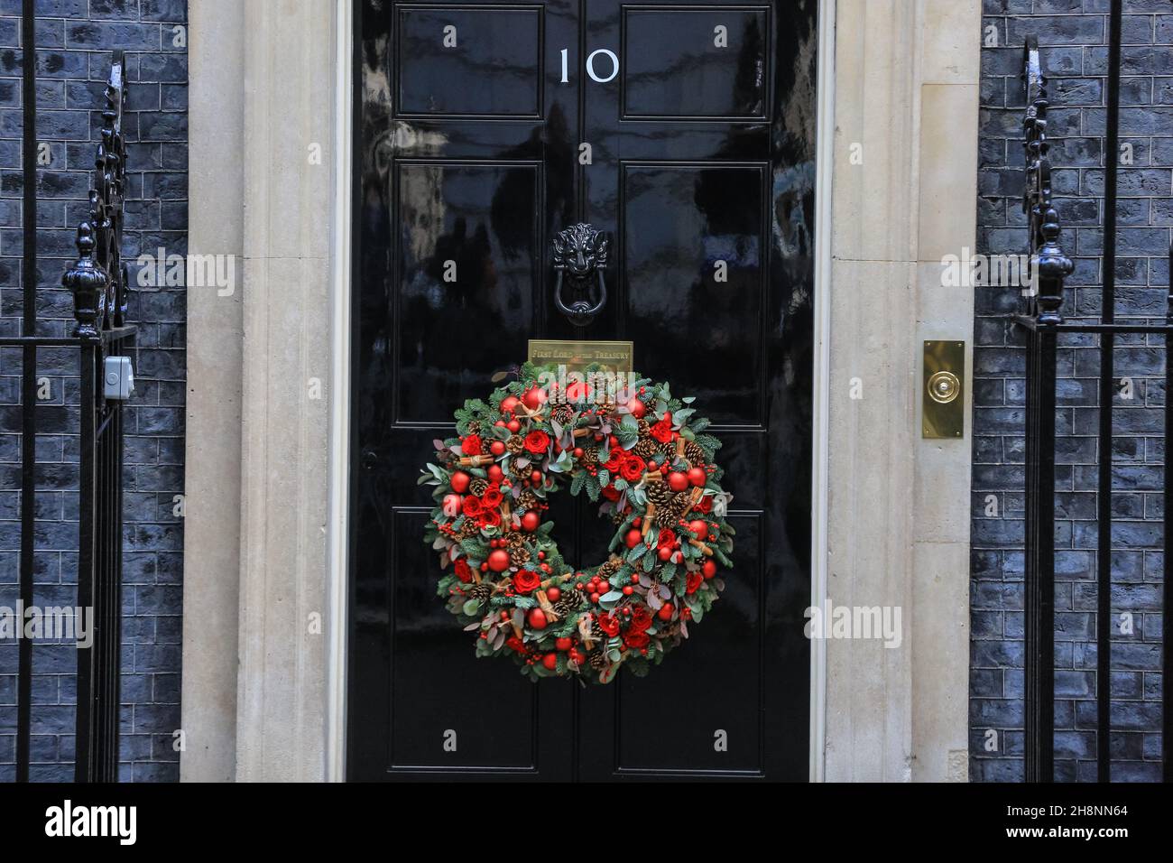 Westminster, London, UK. 01st Dec, 2021. The No 10 door with seasonal decorations, Christmas wreath and festive baubles outside. Credit: Imageplotter/Alamy Live News Stock Photo