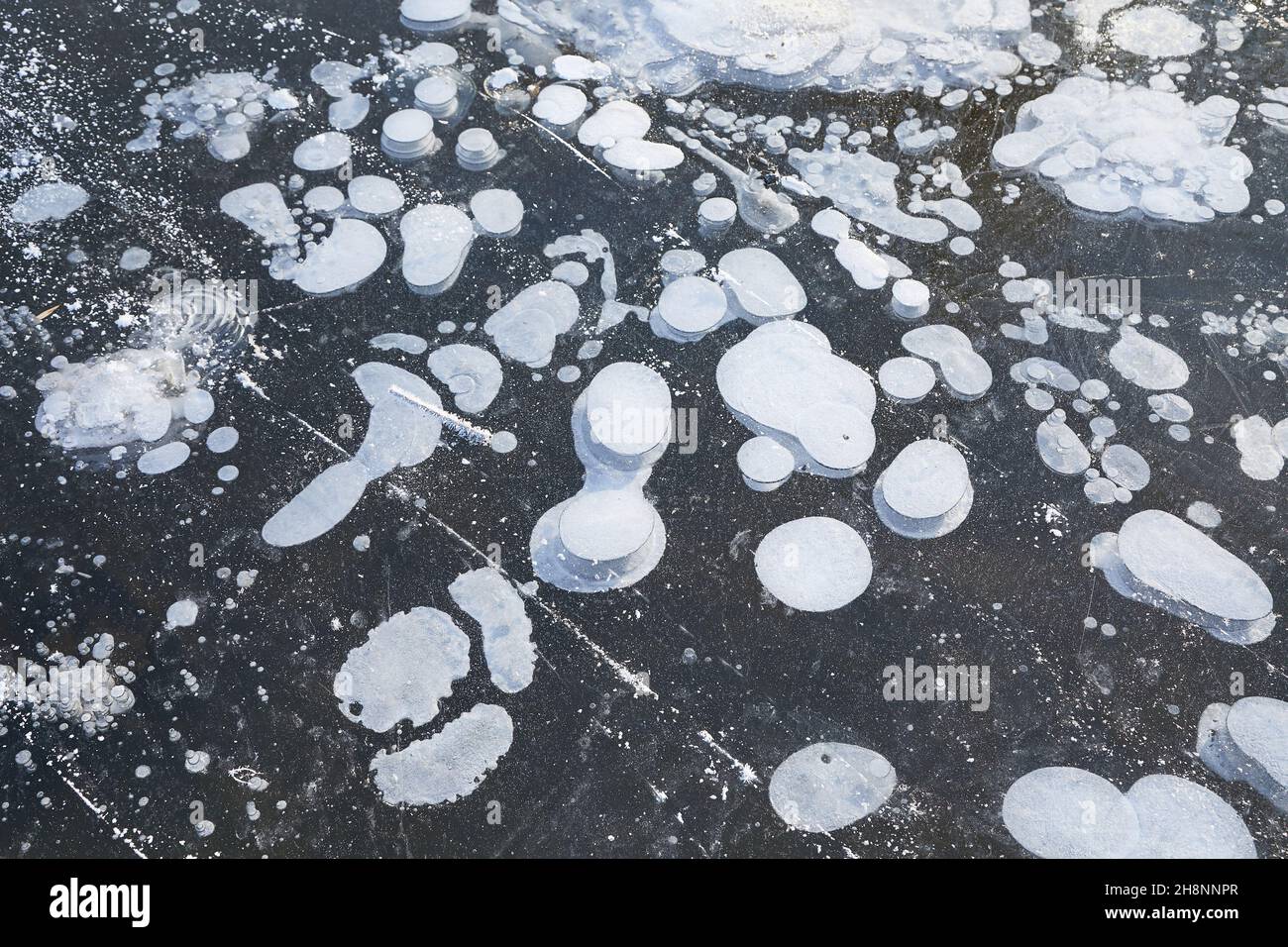Winter ice with gas bubbles trapped inside Stock Photo