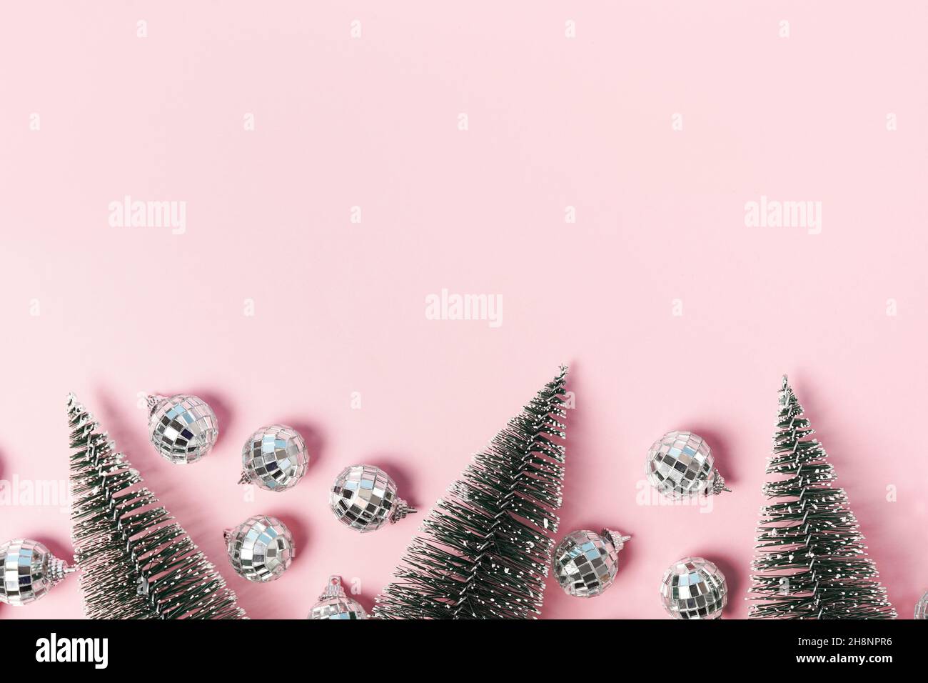 Creative Christmas concept. Shiny gold disco balls over violet background.  Flat lay, top view. New Stock Photo by jchizhe