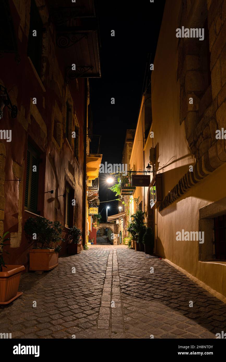 illuminated street with a dark sky in the old town of Chania, Crete, Greece, October 15, 2021 Stock Photo