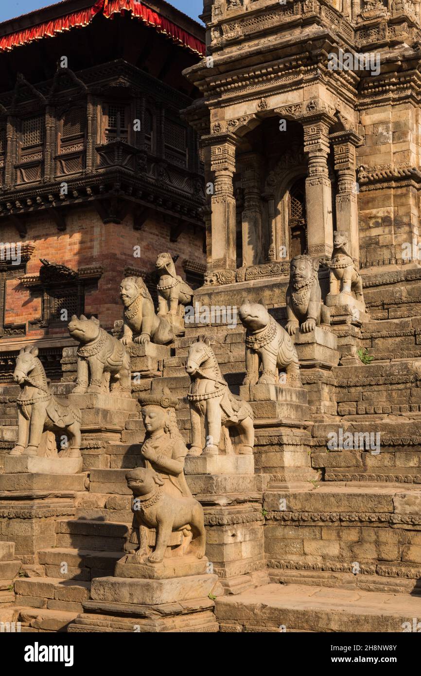 Stone guardians on the Siddhi Laxmi Hindu temple in Durbar Square. Medieval Newar city of Bhaktapur, Nepal. Stock Photo