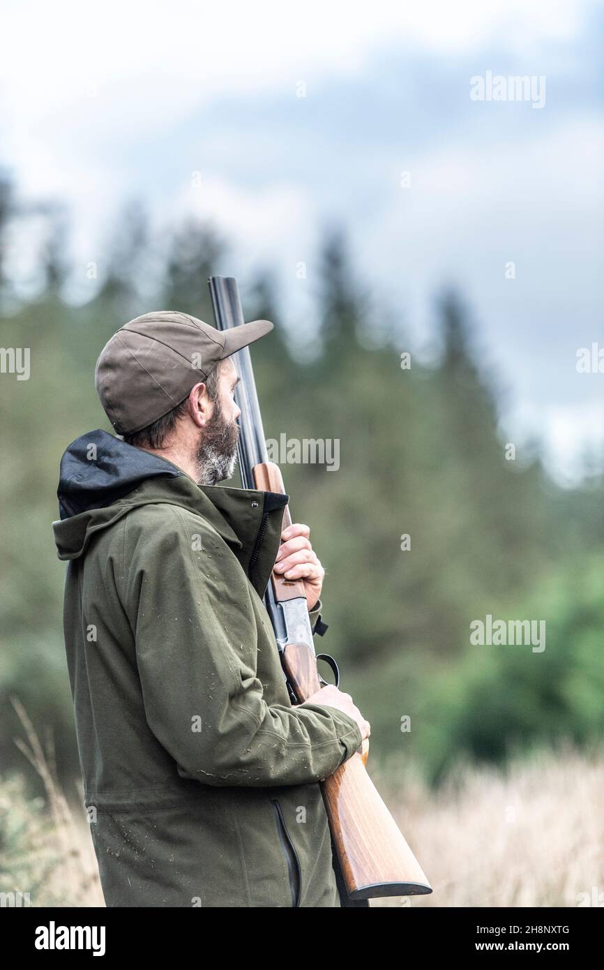 male hunter with shotgun Stock Photo