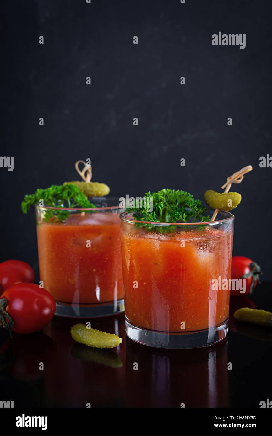 Alcohol cocktail Bloody Mary on dark background. Classic cocktail with