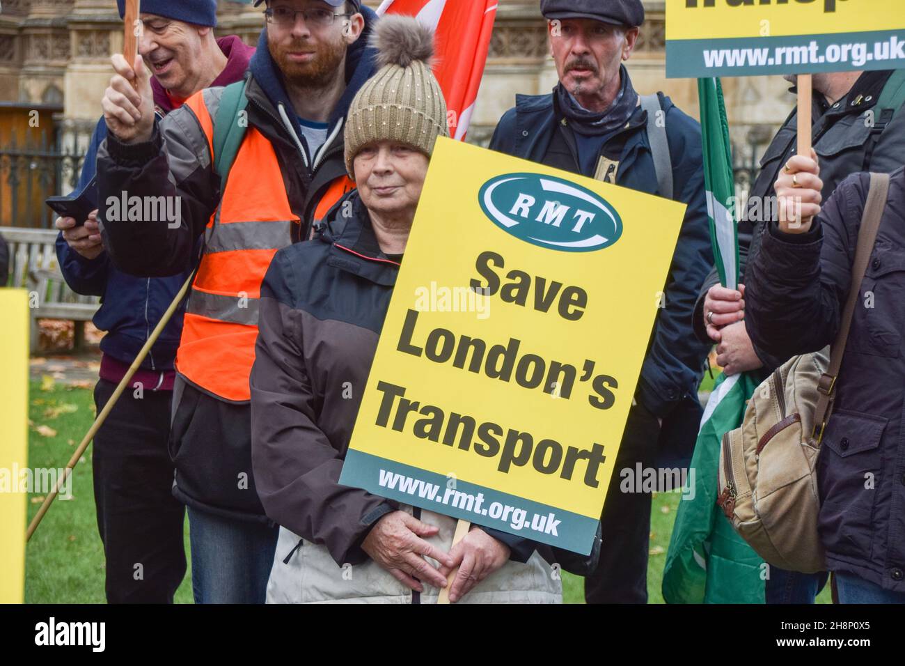 London, UK. 01st Dec, 2021. A protester holds a 'Save London's Transport' placard during the demonstration. Transport workers, union members and supporters gathered at Old Palace Yard outside Parliament in protest against threats to salaries and pensions, and threats to services and jobs, which were imposed as part of the bailout of Transport For London. Credit: SOPA Images Limited/Alamy Live News Stock Photo