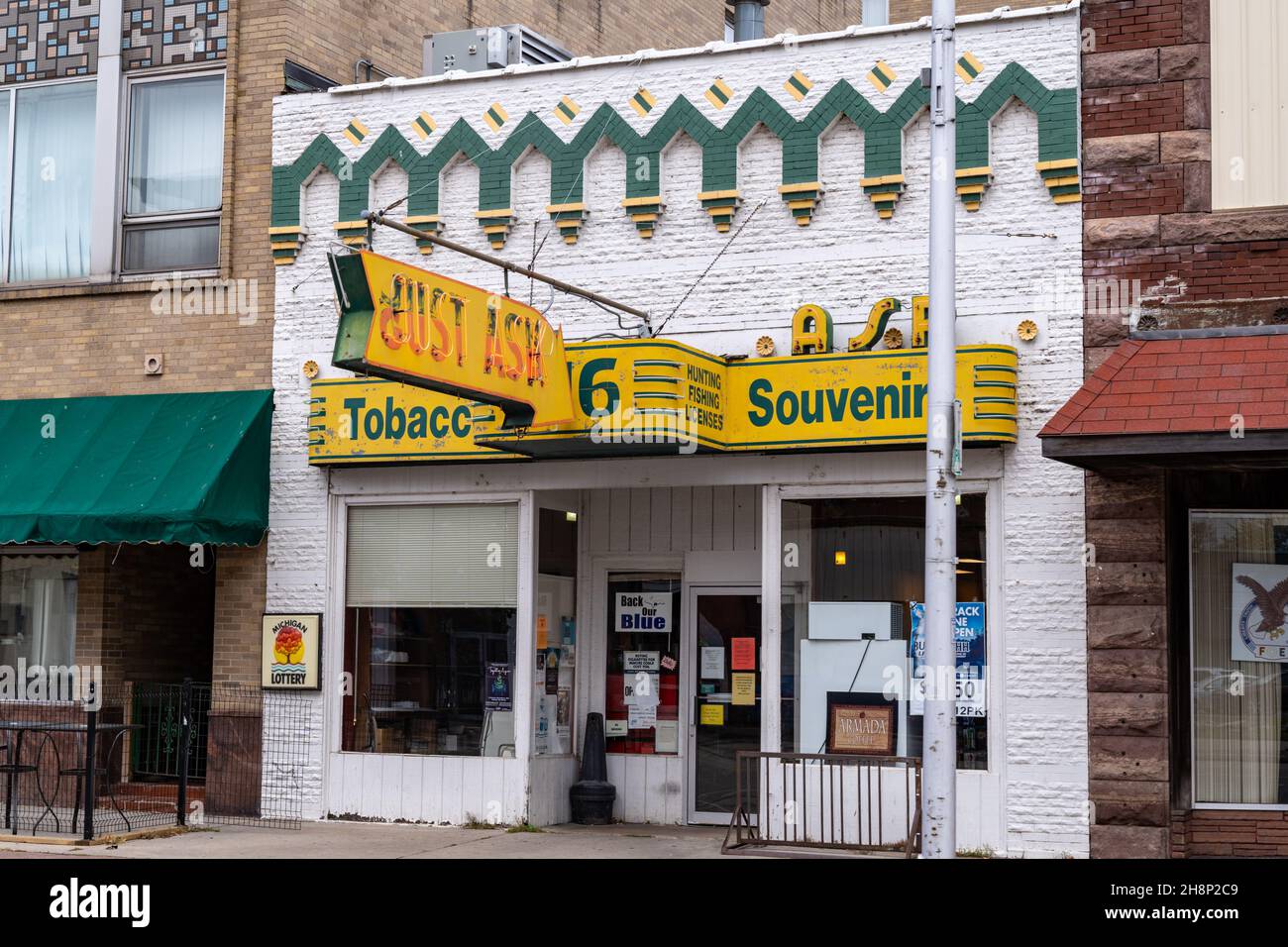 Escanaba, Michigan October 21, 2021 Exterior of the Just Ask Tobacco and Souvenir shop in the